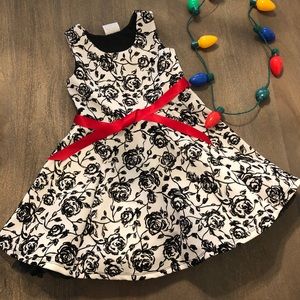 Black white floral holiday dress with red belt. 5